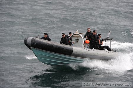 The inspection boarding team was lowered in their Zodiac boat from the frigate, and rapidly departed towards the shore to demonstrate their capabilities.